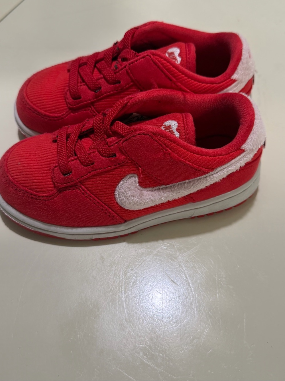 Nike Kids Red Low-Top Sneakers with White Swoosh Accent